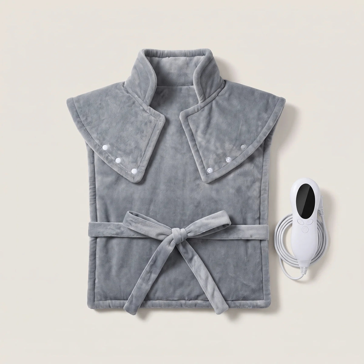 BergHeat Fireside heated wrap in gray with stand-up collar, shoulder panels and tie, hand controller beside it