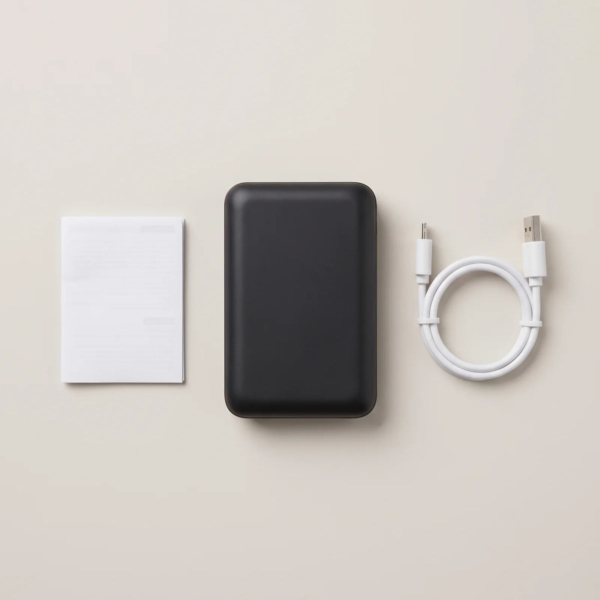 In the box: 10,000 mAh power bank, charging cable and quick guide